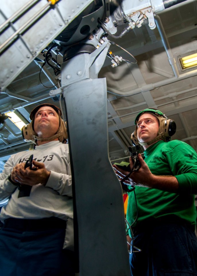 USS Carl Vinson Sailors inspect Seahawk 141024-N-WD464-060