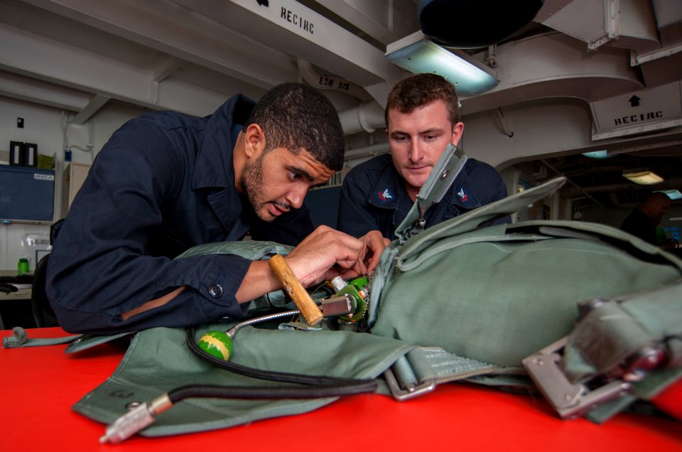 USS Carl Vinson Sailors conduct parachute maintenance 141111-N-TP834-018