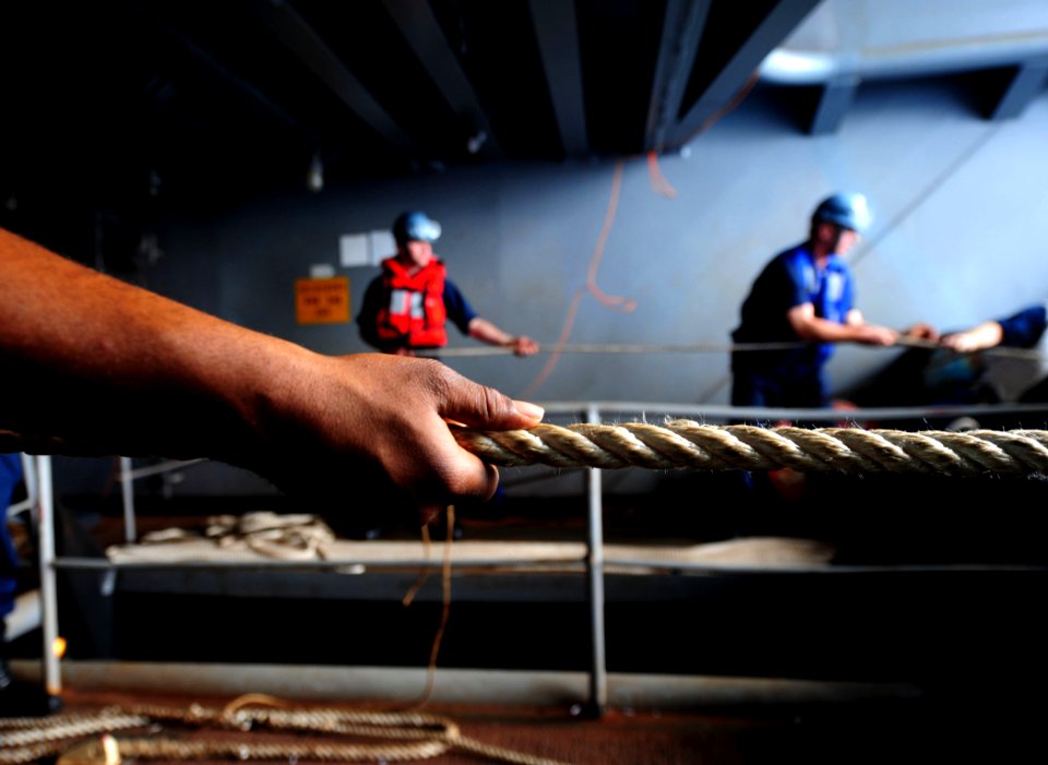 USS Carl Vinson sailor heaves a line during a replenishment-at-sea DVIDS248117