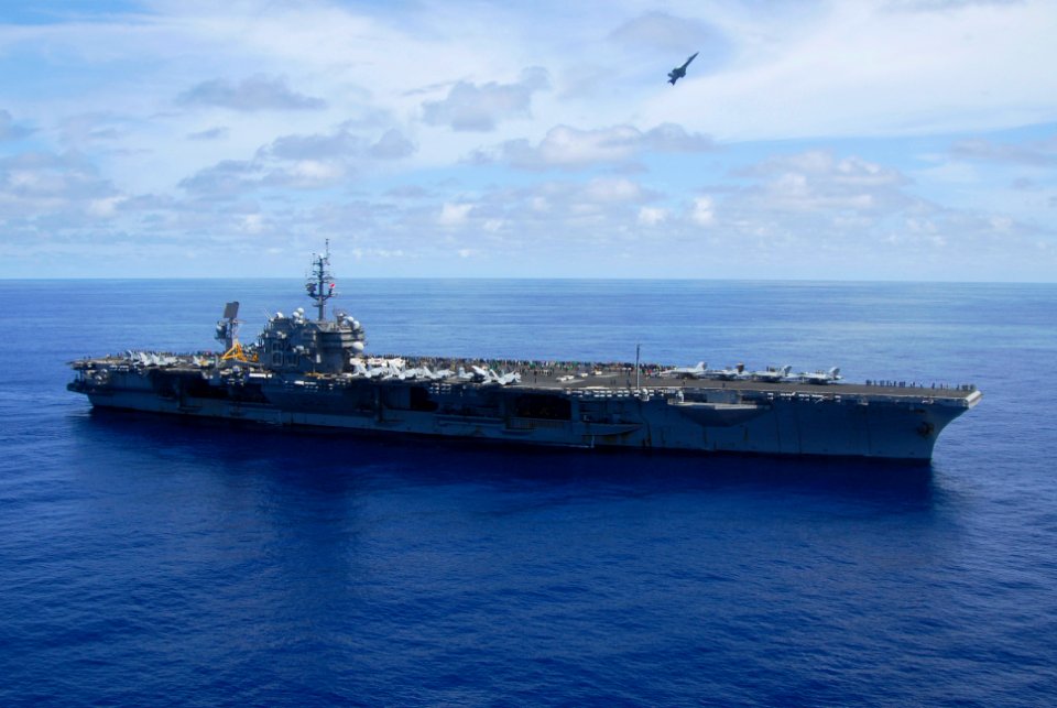 US Navy 070823-N-6106R-089 An F-A-18F Super Hornet, from Strike Fighter Squadron (VFA) 102, performs flight maneuvers over USS Kitty Hawk (CV 63) during an air power demonstration