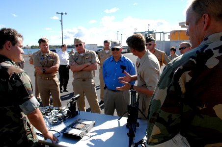 US Navy 070823-N-3642E-717 Secretary of the Navy (SECNAV) the Honorable Dr. Donald C. Winter receives a capabilities brief at the Naval Special Warfare Compound photo