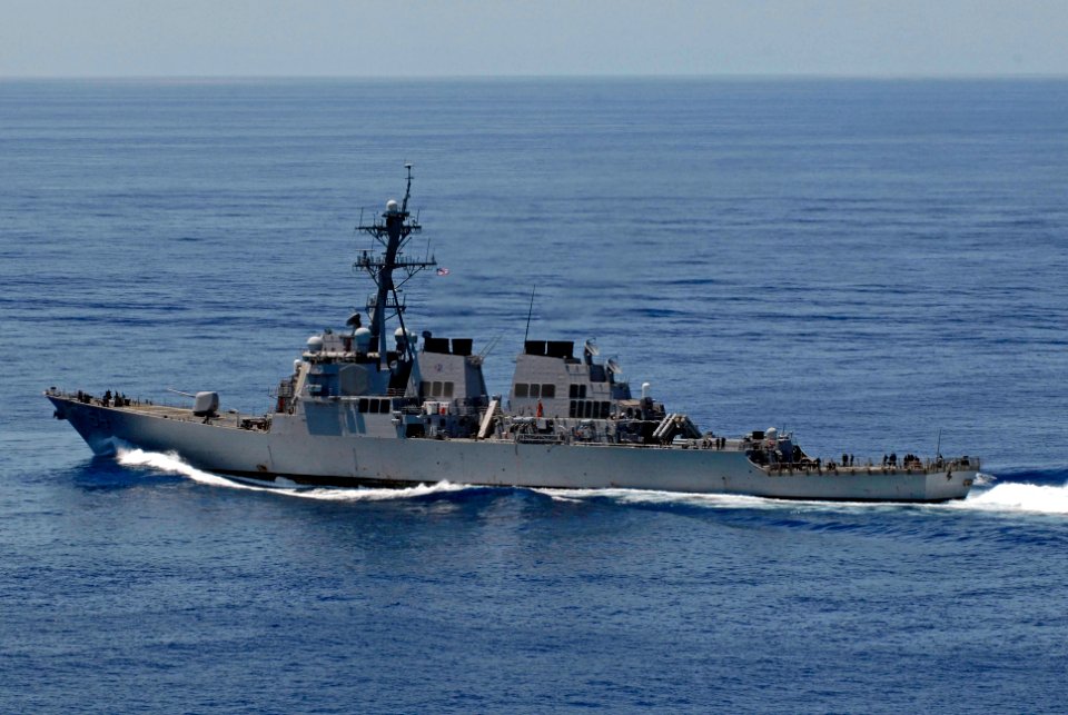 US Navy 070823-N-7883G-006 USS Curtis Wilbur (DDG 54) transits behind USS Kitty Hawk (CV 63) during an air power demonstration in the Pacific