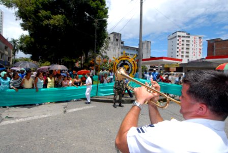 US Navy 070823-N-8704K-031 Musician 2nd Class Brandon Barbee, U.S. Navy Showband trumpet player attached to the Military Sealift Command hospital ship USNS Comfort (T-AH 20), performs with the band in downtown Buenaventura photo