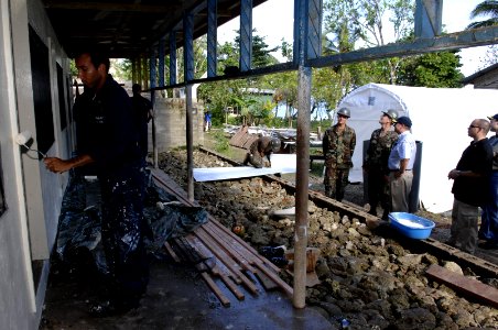 US Navy 070822-N-3642E-283 Secretary of the Navy (SECNAV), the Honorable Dr. Donald C. Winter tours Sassamungga where Seebees with Amphibious Construction Battalion (ACB) 1 and Naval Mobile Construction Battalion (NMCB) 7 are b