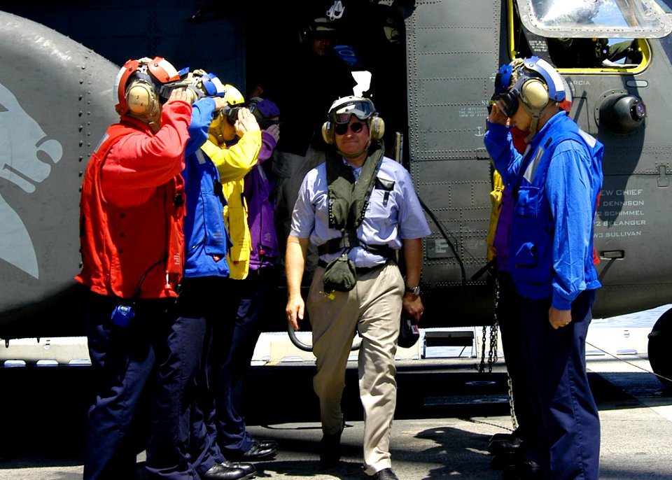 US Navy 070822-N-1752H-100 Secretary of the Navy (SECNAV), the Honorable Dr. Donald C. Winter walks among the rainbow sideboys on the flight deck of USS Peleliu (LHA 5)