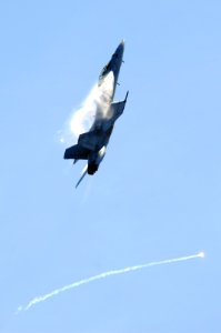 US Navy 070823-N-3136P-222 An F-A-18F Super Hornet, assigned to Strike Fighter Squadron (VFA) 102, fires off its flares while performing evasive maneuvers during an air power demonstration