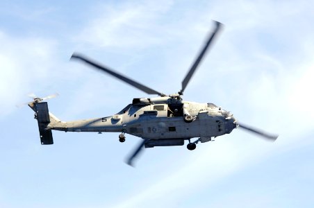 US Navy 070823-N-3136P-001 An SH-60F Seahawk, assigned to Helicopter Anti-Submarine Squadron (HS) 14, flies through the air acting as plane guard for USS Kitty Hawk (CV 63) during an air power demonstration