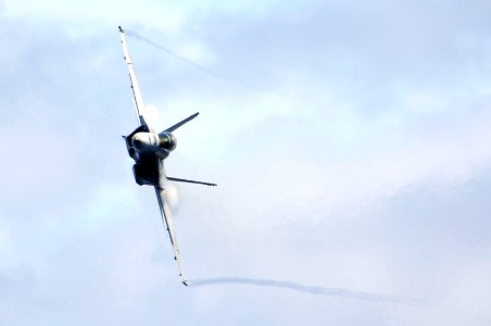 US Navy 070823-N-3136P-214 Water vapor flows over the wings of an F-A-18F Super Hornet assigned to Strike Fighter Squadron (VFA) 102, as it performs a high-speed pass during an air power demonstration