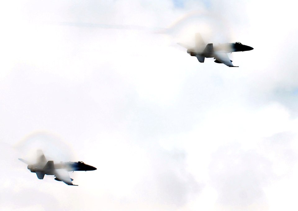 US Navy 070824-N-0684R-026 A pair of F-A-18C Hornets perform high-speed passes during an air power demonstration over Nimitz-class aircraft carrier USS John C. Stennis (CVN 74)