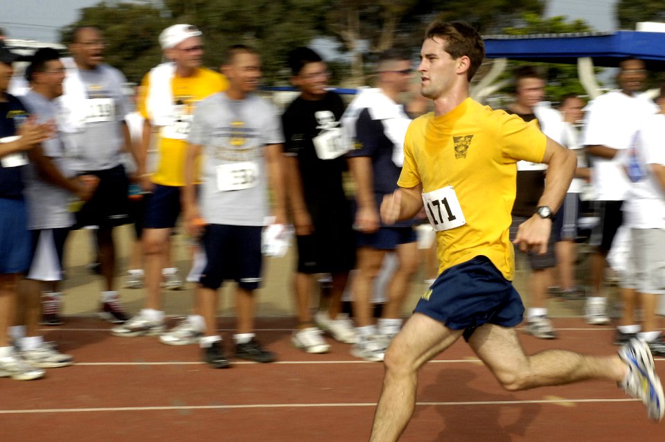 US Navy 070822-N-7498L-205 Ensign Ryan Bohning, attached to Ticonderoga-class guided-missile cruiser USS Lake Chaplain (CG 57), sprints the last leg of the 5k run event in the 2007 Surface Line Week competition