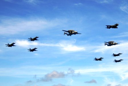 US Navy 070823-N-6106R-224 Aircraft assigned to Carrier Air Wing 5 fly over USS Kitty Hawk (CV 63), USS Cowpens (CG 63), USS Mustin (DDG 89), USS Curtis Wilbur (DDG 54), and USNS Pecos (T-AO 197)