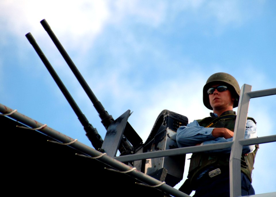 US Navy 070824-N-0879R-009 A Sailor stands a force protection watch aboard Oliver Hazard Perry-class guided-missile frigate USS Reuben James (FFG 37) as the ship departs for the Western Pacific