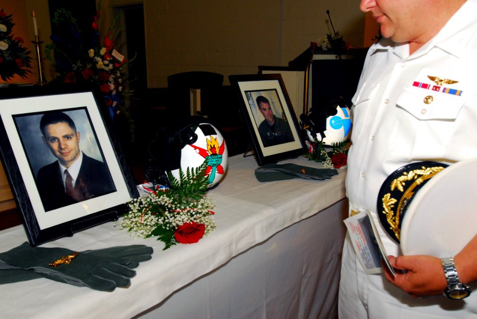 US Navy 070823-N-2456S-017 Friends, family and fellow shipmates pay their final respects during a memorial service at Naval Station Norfolk's David Adams Memorial Chapel in honor of three E-2C Hawkeye pilots attached to Carrier