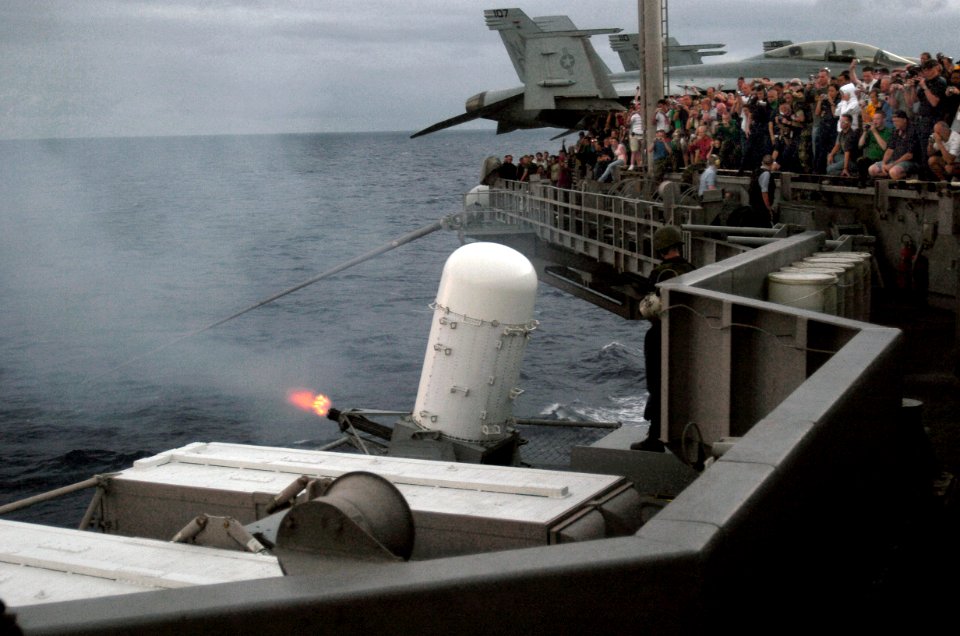 US Navy 070824-N-3038W-343 Friends and family of Sailors aboard Nimitz-class aircraft carrier USS John C. Stennis (CVN 74) watch a demonstration of the ship's close-in weapon system as part of an air power demonstration