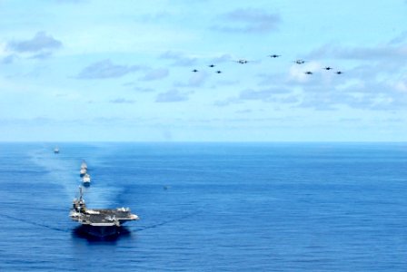 US Navy 070823-N-7883G-030 Aircraft assigned to Carrier Air Wing 5 fly over USS Kitty Hawk (CV 63), USS Cowpens (CG 63), USS Mustin (DDG 89), USS Curtis Wilbur (DDG 54), and USNS Pecos (T-AO 197)