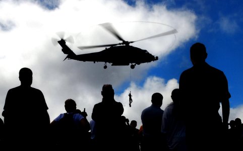 US Navy 070824-N-0684R-083 Rescue swimmer Chief Aviation Warfare Systems Operator Sean Coburn is lowered from an HH-60H Seahawk during an air power demonstration aboard Nimitz-class aircraft carrier USS John C. Stennis (CVN 74)