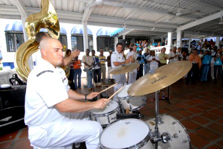 US Navy 070823-N-8704K-070 Musician 2nd Class Oscar Munoz, U.S. Navy Showband drummer attached to the Military Sealift Command hospital ship USNS Comfort (T-AH 20), performs with the band at the Estacion Hotel in downtown Buena photo