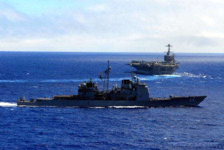 US Navy 070824-N-2659P-433 Guided-missile cruiser USS Antietam (CG 54) transits with Nimitz-class aircraft carrier USS John C. Stennis (CVN 74) prior to Stennis conducting an air power demonstration photo