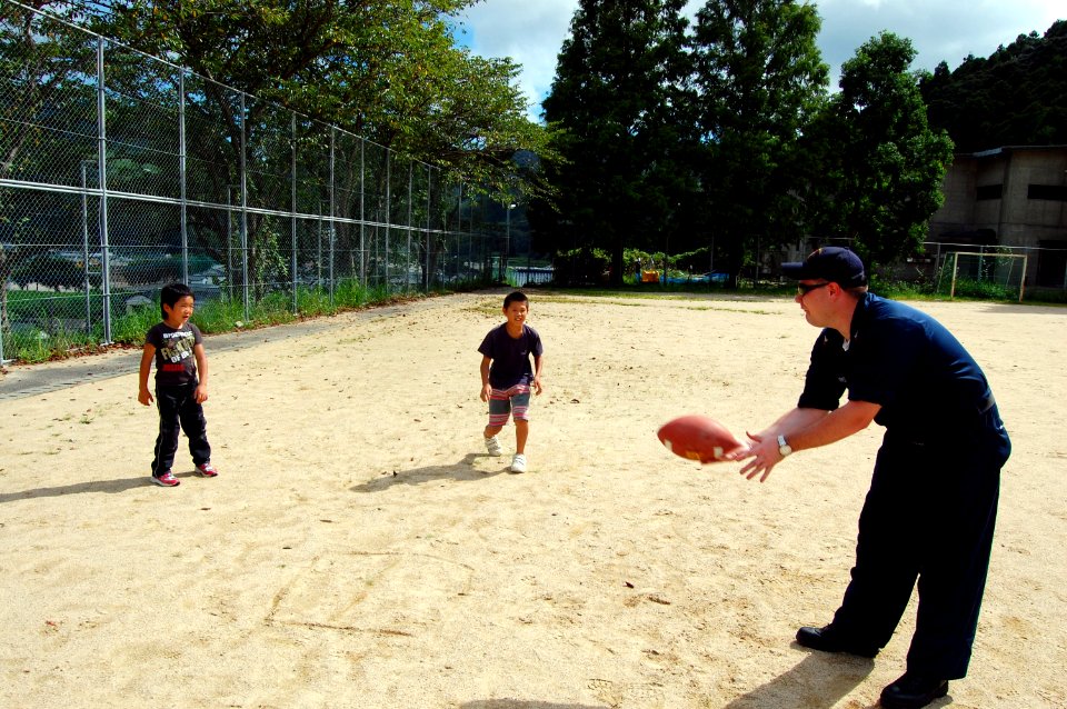 US Navy 070826-N-4124C-048 Hull Maintenance Technician 1st Class Jamey K. Parks, assigned to USS Juneau (LPD 10), plays catch with kids at the Tenshin-ryo Children's Home
