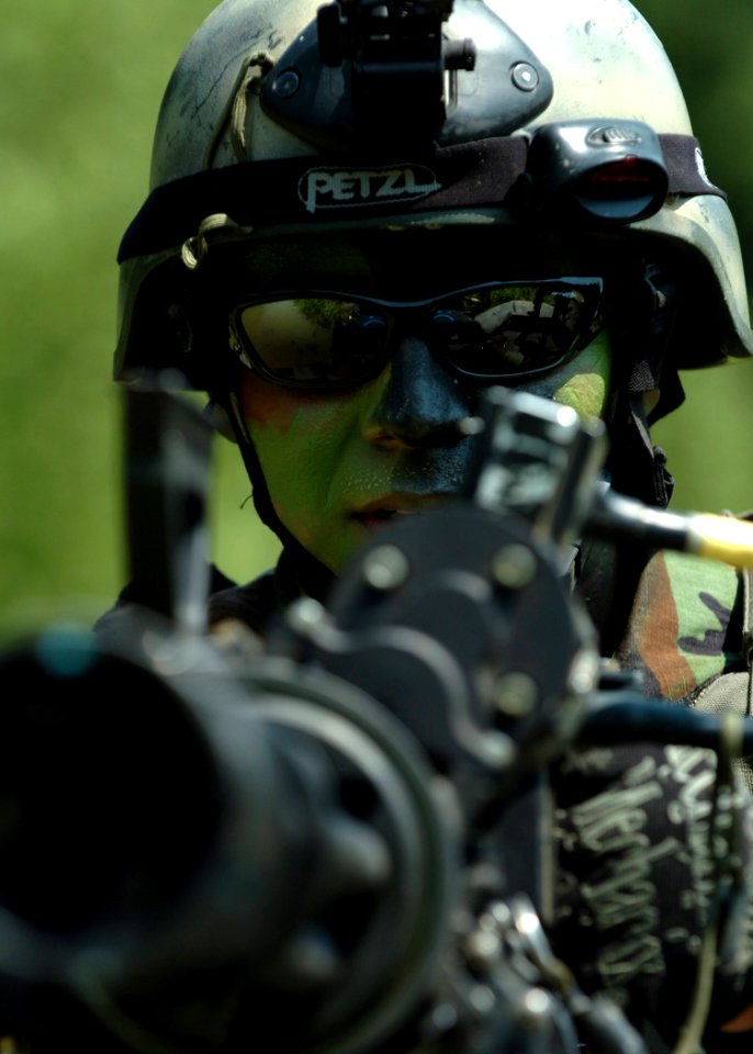 US Navy 070825-N-9769P-585 A Special Warfare Combatant-craft crewman (SWCC) mans his GAU-17 minigun during live-fire patrol training along the Salt River in northern Kentucky