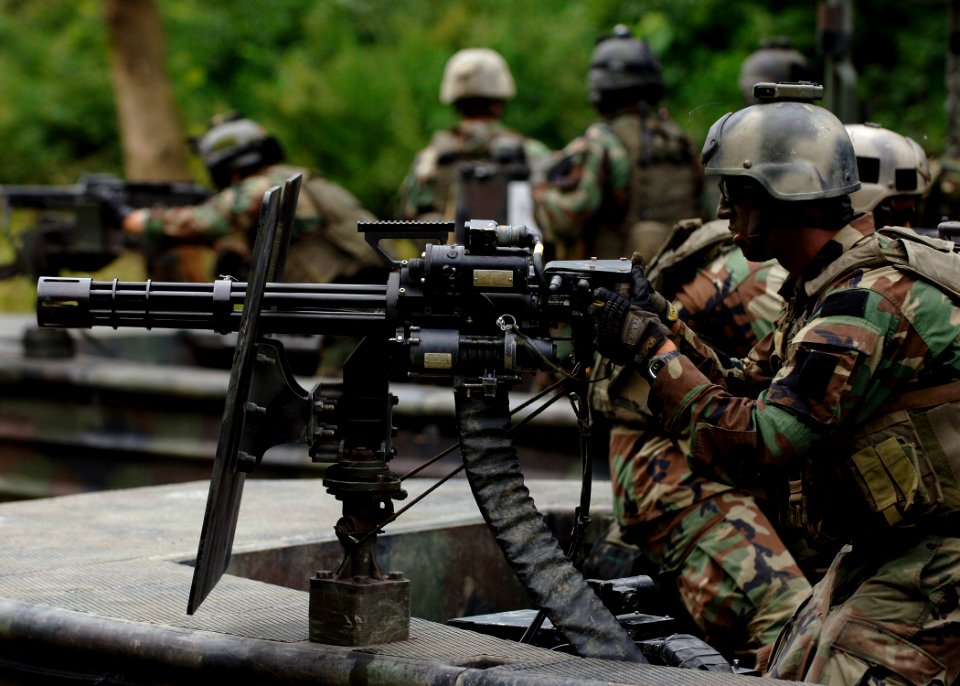 US Navy 070825-N-9769P-317 A Special Warfare Combatant-craft crewman (SWCC) mans his GAU-17 minigun during live-fire patrol training along the Salt River in northern Kentucky
