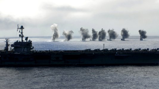 US Navy 070824-N-2659P-139 Water sprays up after two F-A-18F Super Hornets, from the
