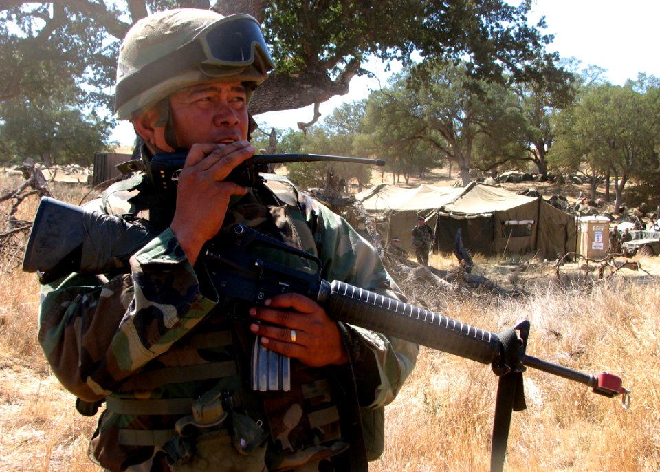 US Navy 070827-N-8547M-061 Chief Boatswain's Mate Joselito P. Sacramento, of Naval Mobile Construction Battalion (NMCB) 5, radios headquarters during a security alert drill in Operation Bearing Duel 6-07