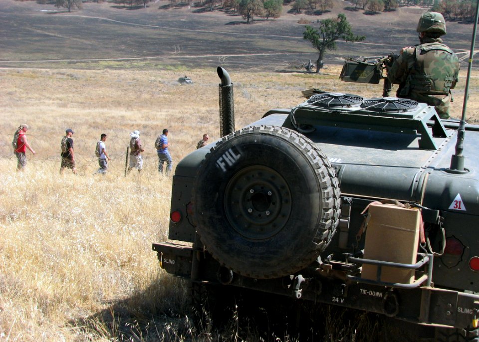 US Navy 070827-N-8547M-051 A Seabee attached to Naval Mobile Construction Battalion (NMCB) 5 mans an M2 .50-caliber machine gun during a security alert drill