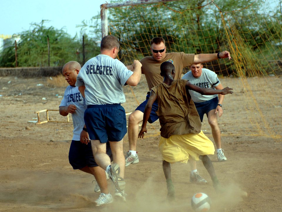 US Navy 070827-N-1003P-050 Sailors going through chief petty officer transition and other chief petty officers enjoy a game of soccer at a boys orphanage