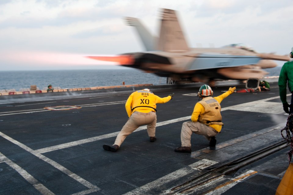 USS Carl Vinson EO directs aircraft 141101-N-HD510-084