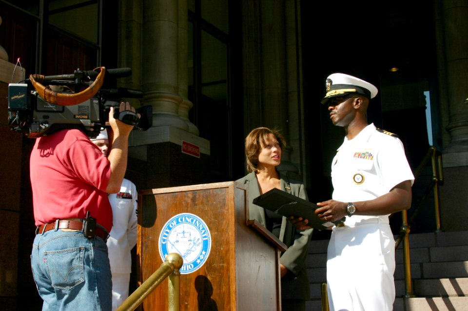 US Navy 070827-N-7163S-002 Cmdr. Will Nelson, commanding officer of Navy Recruiting District Ohio, accepts a proclamation from City Councilmember Laketa Cole announcing Aug. 27 to Sept. 3 to be Cincinnati Navy Week during a cer
