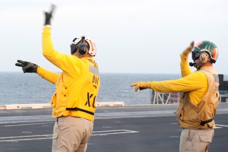 USS Carl Vinson EO directs aircraft 141101-N-HD510-077