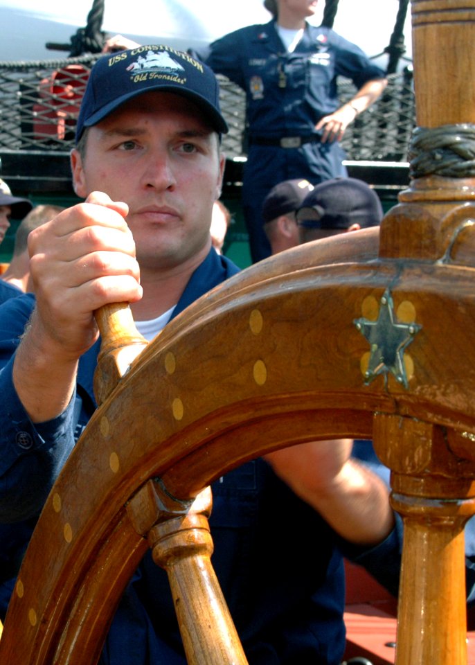 US Navy 070831-N-2893B-010 Information Systems Technician 2nd Class Jack Shrader mans the helm aboard the USS Constitution during an underway demonstration