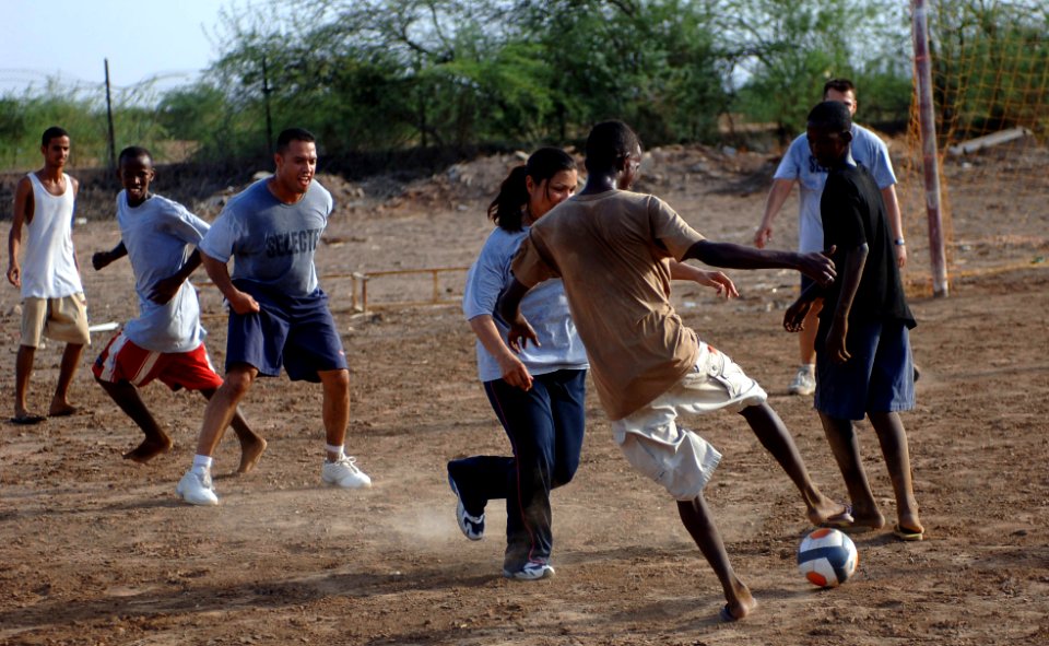 US Navy 070827-N-1003P-081 Sailors going through chief petty officer transition and other chief petty officers enjoy a game of soccer at a boys orphanage