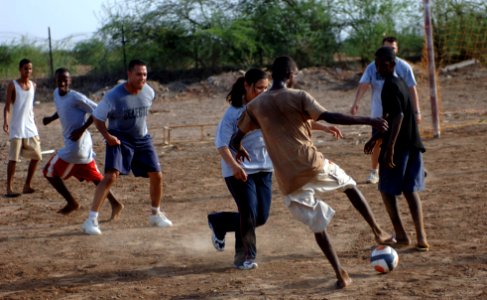 US Navy 070827-N-1003P-081 Sailors going through chief petty officer transition and other chief petty officers enjoy a game of soccer at a boys orphanage