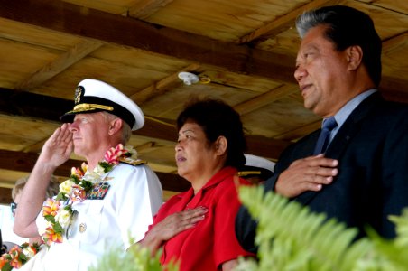 US Navy 070829-N-6410J-134 Adm. Robert F. Willard, commander of U.S. Pacific Fleet, renders a salute while Republic of the Marshall Islands President Kessai Note and the first lady pledge allegiance during a playing of the nati