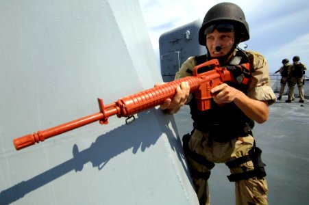 US Navy 070901-N-1810F-234 Cryptologic Technician 2nd Class Michael Whisenant, assigned to a visit, board, search and seizure (VBSS) team aboard guided-missile destroyer USS Mitscher (DDG 57), embarks aboard French frigate FS V