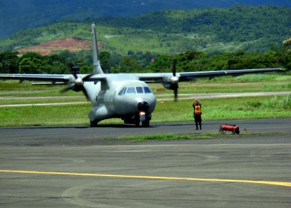 US Navy 070901-N-1713L-047 A Panamanian airman guides a Colombian CN-235 aircraft onto the tarmac at Tocumen International Airport as part of the Combined Forces Air Combatant Command during PANAMAX 2007