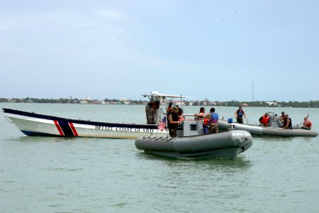 US Navy 070830-N-0989H-350 Members of the Belize Coast Guard do boat maneuvers with U.S. Navy trainers during a patrol craft operations course as part of the pilot Global Fleet Station (GFS)