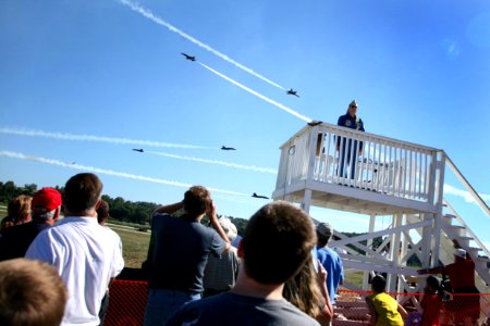 US Navy 070901-N-3271W-006 Air Show fans watch as the U.S. Navy flight demonstration team, the Blue Angels, perform at the St. Louis County Fair and Air Show