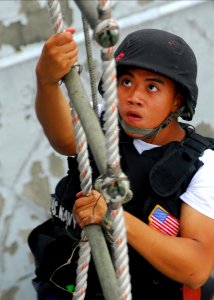 US Navy 070830-N-2638R-005 Torpedoman's Mate Seaman Chris Sollano, from Arleigh Burke-class guided-missile destroyer USS Lassen (DDG 82), climbs a 30-foot ladder during a ladder climb qualification on board Commander Fleet Acti