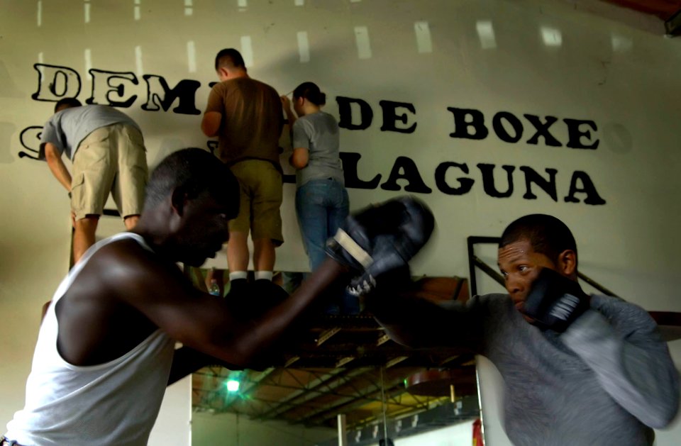 US Navy 070830-N-1810F-104 Training continues while Sailors from amphibious assault ship USS Wasp (LHD 1) and guided-missile destroyer USS Mitscher (DDG 57) paint letters as part of a community relations project with Academia D