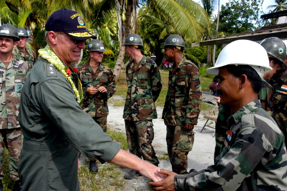 US Navy 070829-N-6410J-139 Adm. Robert F. Willard, commander of U.S. Pacific Fleet, thanks Sgt. D. Deka of the Indian army for his support during Pacific Partnership