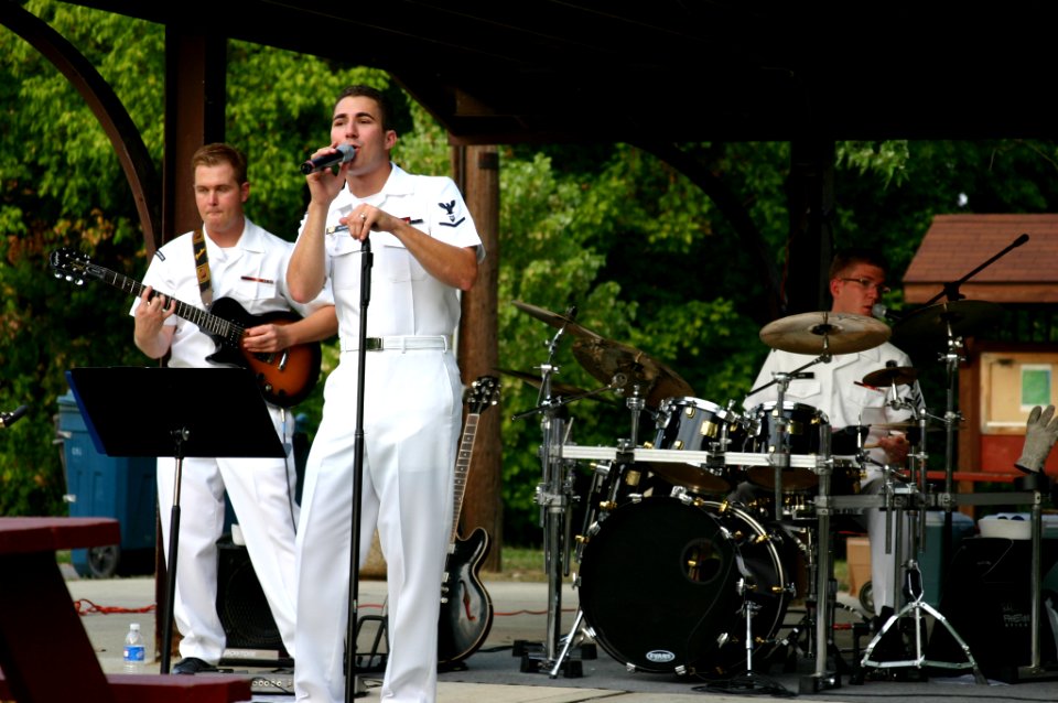 US Navy 070828-N-7163S-008 (From left) Musician 3rd Class Joe Gacioch, Musician 3rd Class Justin Glenn, and Musician 2nd Class Ted Moore of Navy Band Great Lakes' rock band Horizon perform rock standards at