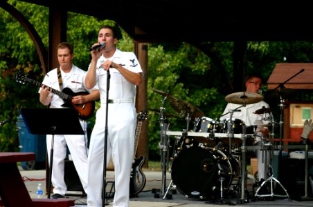 US Navy 070828-N-7163S-008 (From left) Musician 3rd Class Joe Gacioch, Musician 3rd Class Justin Glenn, and Musician 2nd Class Ted Moore of Navy Band Great Lakes' rock band Horizon perform rock standards at