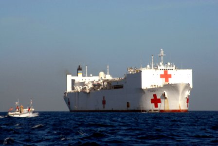 US Navy 070902-N-8704K-019 A utility boat approaches Military Sealift Command hospital ship USNS Comfort (T-AH 20) while at anchorage