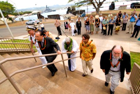 US Navy 070828-N-6674H-027 Rear Adm. Alexander, accompanied by government officials and representatives of Hunt Development Group and Fluor Federal Services, proceed to the entrance of the newly renovated Ford Island Building 8