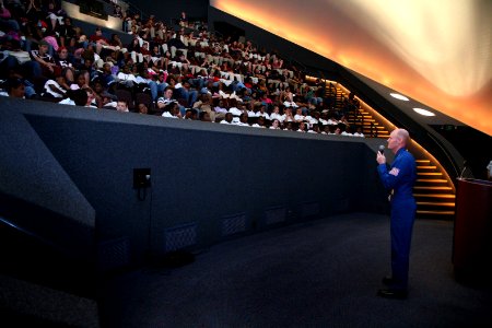 US Navy 070831-N-3271W-002 Lt. Cmdr. Anthony Walley, ^2 Pilot of the U.S. Navy flight demonstration team, the Blue Angels, speaks with students in the Omniplex theater at the St. Louis Science Center photo