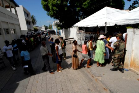 US Navy 070902-N-8704K-164 Patients line up outside Hopital De L'universite D'etat D'Haiti, where Military Sealift Command hospital ship USNS Comfort (T-AH 20) personnel are providing medical care