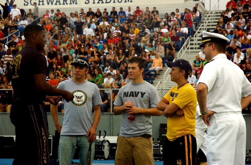 US Navy 070830-N-1805P-003 Special Warfare Boat Operator 1st Class Dave Fisher and Lt. Cmdr. Paul Mountel discuss Navy careers with students of Hamilton High School after a Navy Week performance by the U.S. Navy Parachute Demon